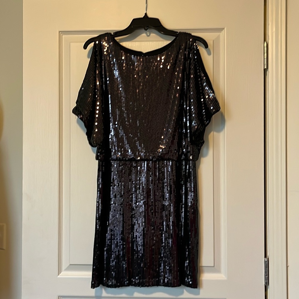The Perfect LBD! Just enough shine for any holiday occasion. An Xscape design!